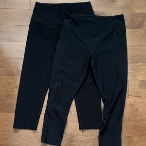 TWO pairs of black capri leggings